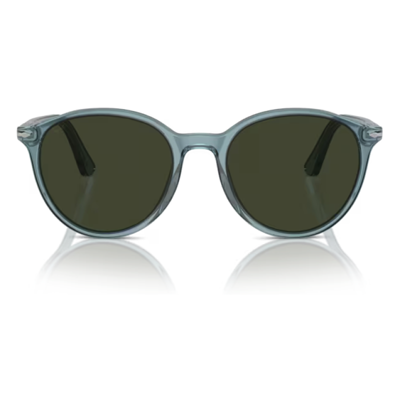 Occhiali da sole Komono modello Lennon, colore Blue Tortoise, forma rotonda con montatura trasparente blu e lenti scure.