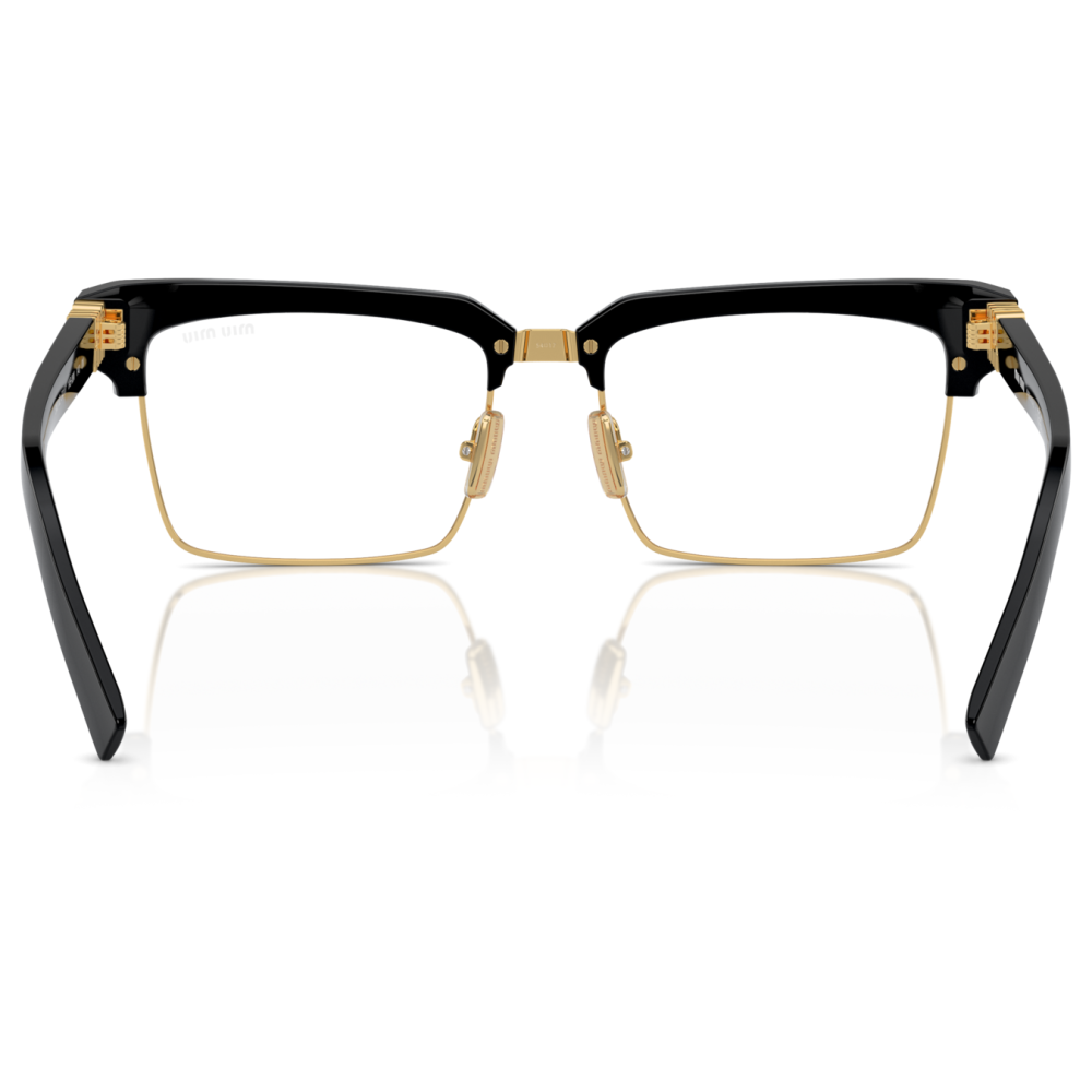 Occhiali da vista squadrati con montatura nera e dettagli in oro, materiale plastico e metallico.