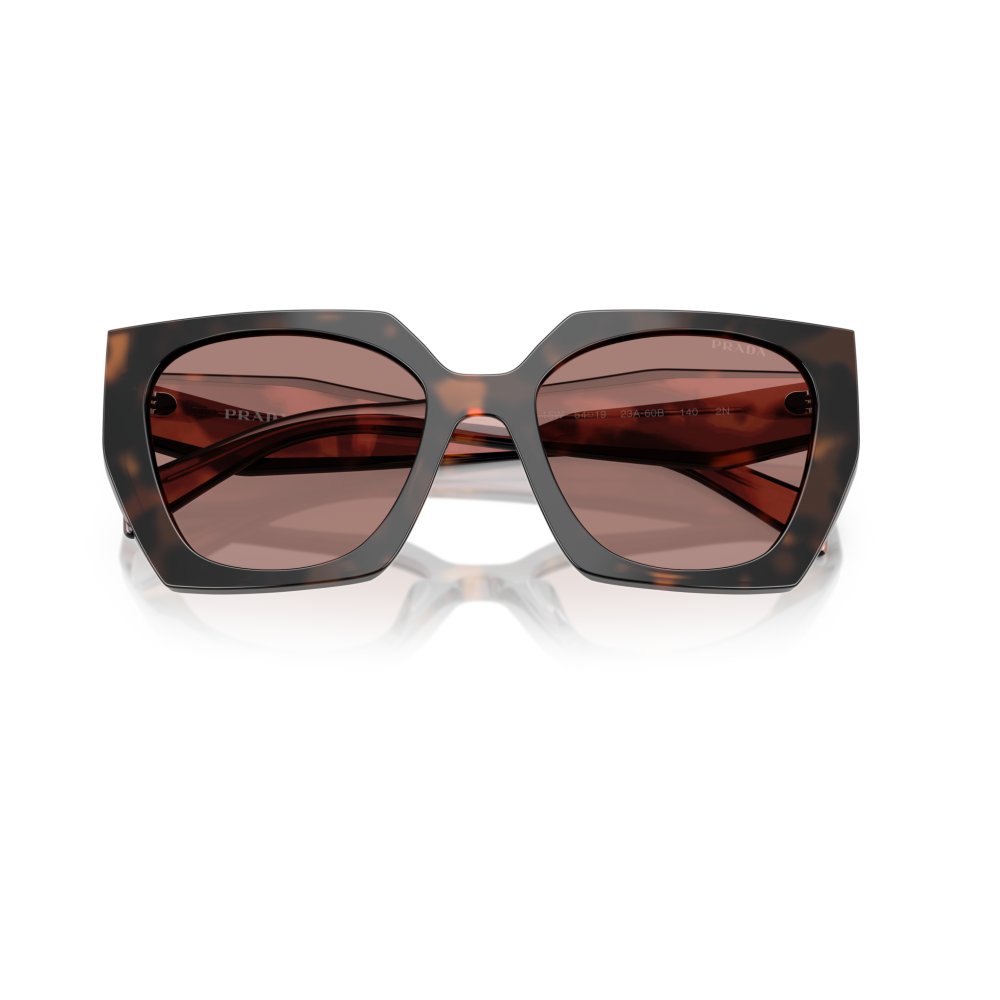 Occhiali da sole Prada, montatura oversize tartarugata con lenti gradiente marroni, forma geometrica.