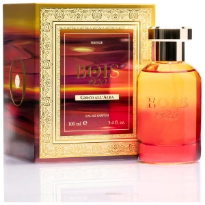 Profumo Bois 1920 Gioco all'Alba, elegante confezione dorata e boccetta sfumata arancione-rosso.