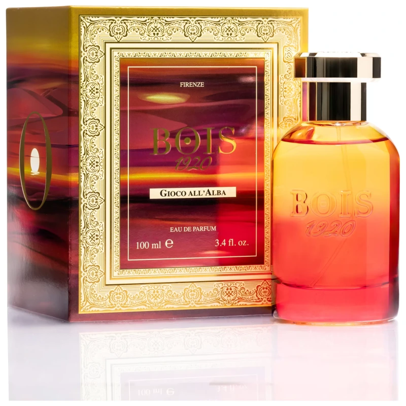 Profumo Bois 1920 Gioco all'Alba, elegante confezione dorata e boccetta sfumata arancione-rosso.