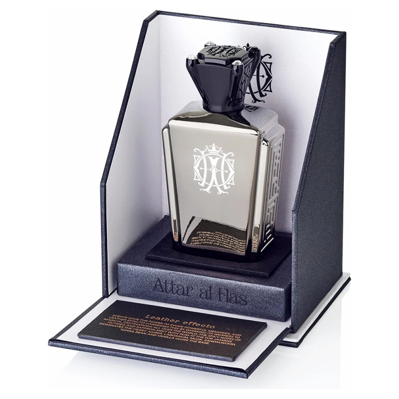 Profumo Attar al Has in elegante flacone nero e argento, presentato in confezione raffinata.
