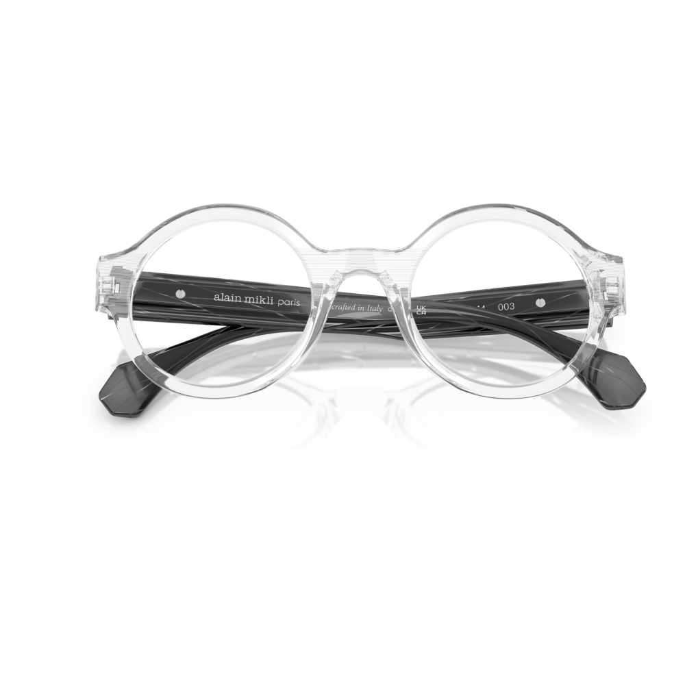 Occhiali Alain Mikli, montatura rotonda trasparente, design moderno ed elegante, realizzata in Italia.