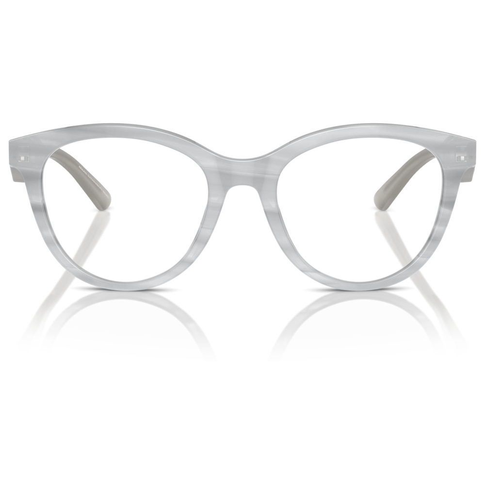 Occhiali da vista con montatura trasparente in acetato, forma tondeggiante. Marchio non visibile.