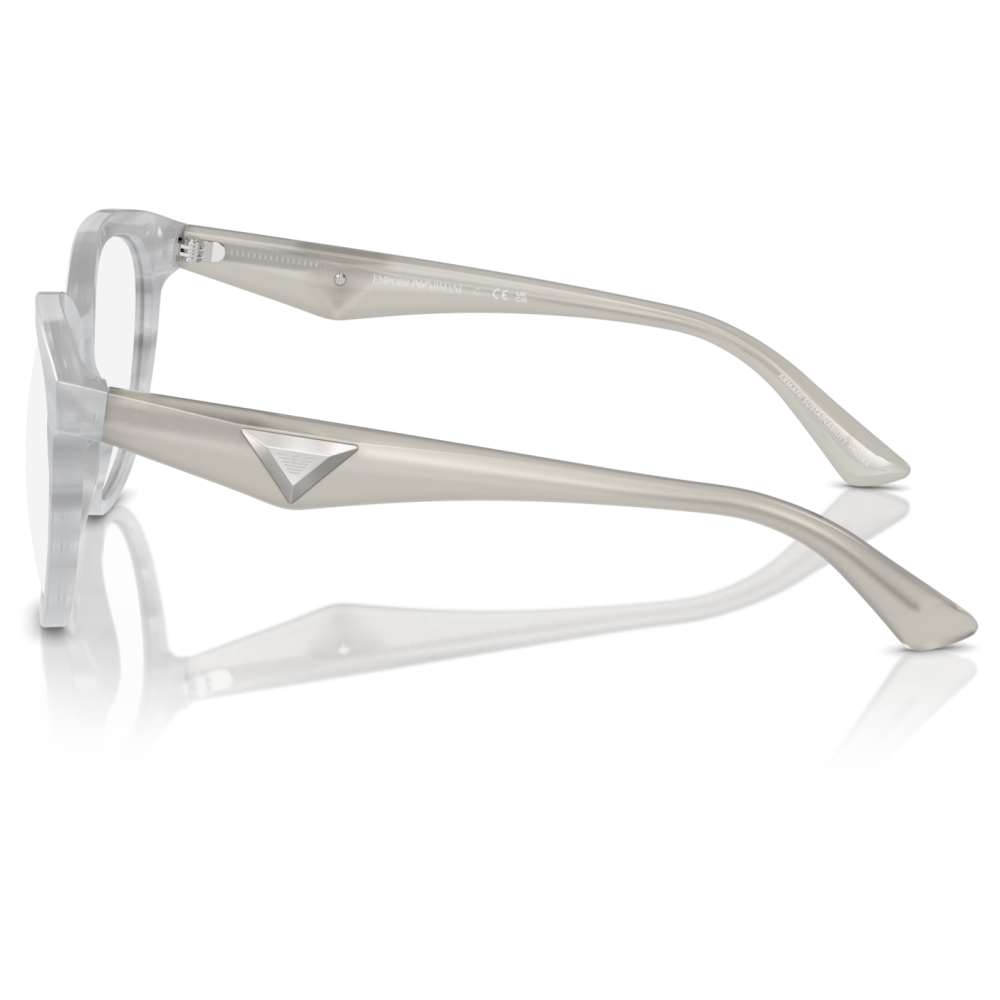 Occhiali Emporio Armani, montatura squadrata in acetato trasparente e stanghette grigie con logo triangolare.