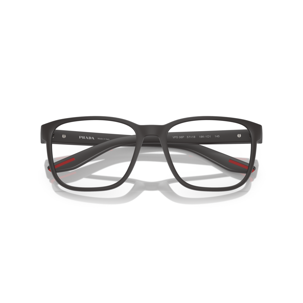 Occhiali Prada, montatura rettangolare, colore nero opaco con dettagli rossi, eleganza moderna.
