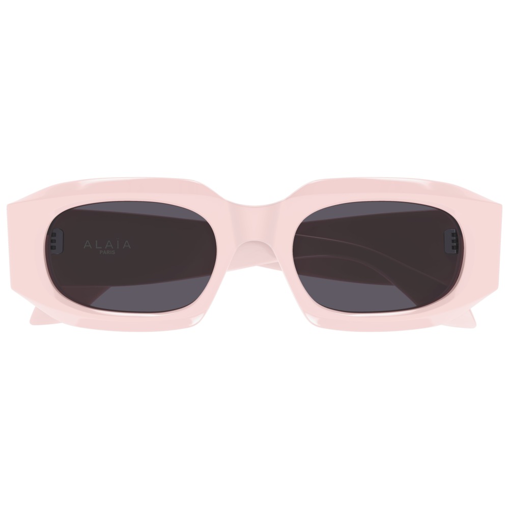Occhiali da sole ALAÏA, montatura rettangolare rosa chiaro con lenti scure.