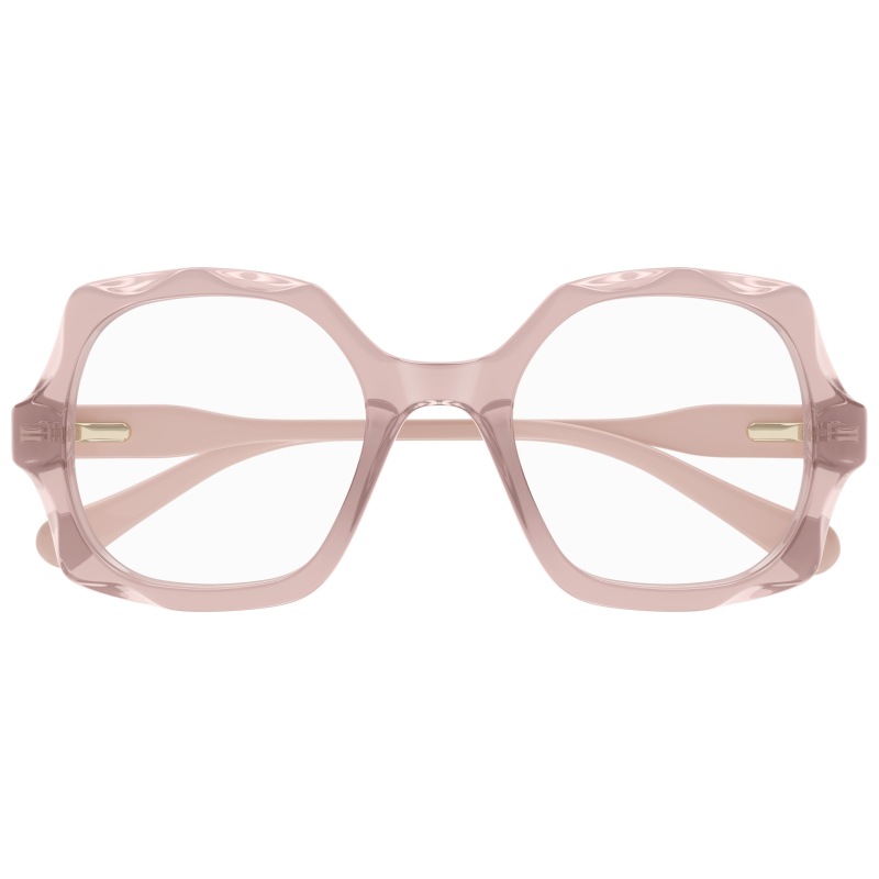 Occhiali da vista oversize in acetato rosa chiaro, forma quadrata, dettagli dorati sul lato.