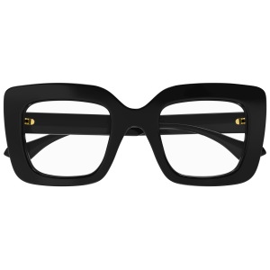 Occhiali neri oversize, montatura rettangolare spessa, dettagli dorati sulle aste. Eleganti e moderni.