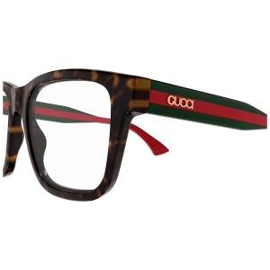 Occhiali Gucci, montatura squadrata tartarugata, aste verdi e rosse con logo dorato.