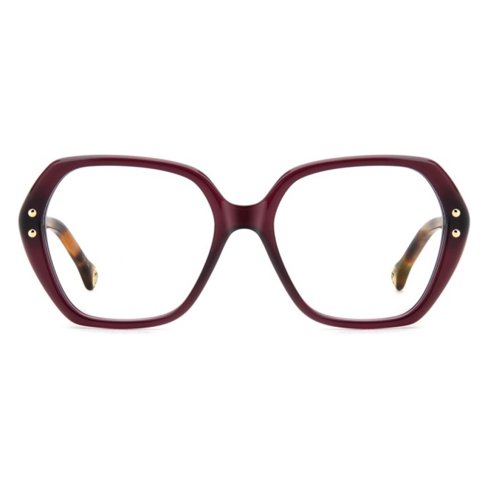 Occhiali da vista Prada, montatura oversize, forma esagonale, colore bordeaux con dettagli dorati.